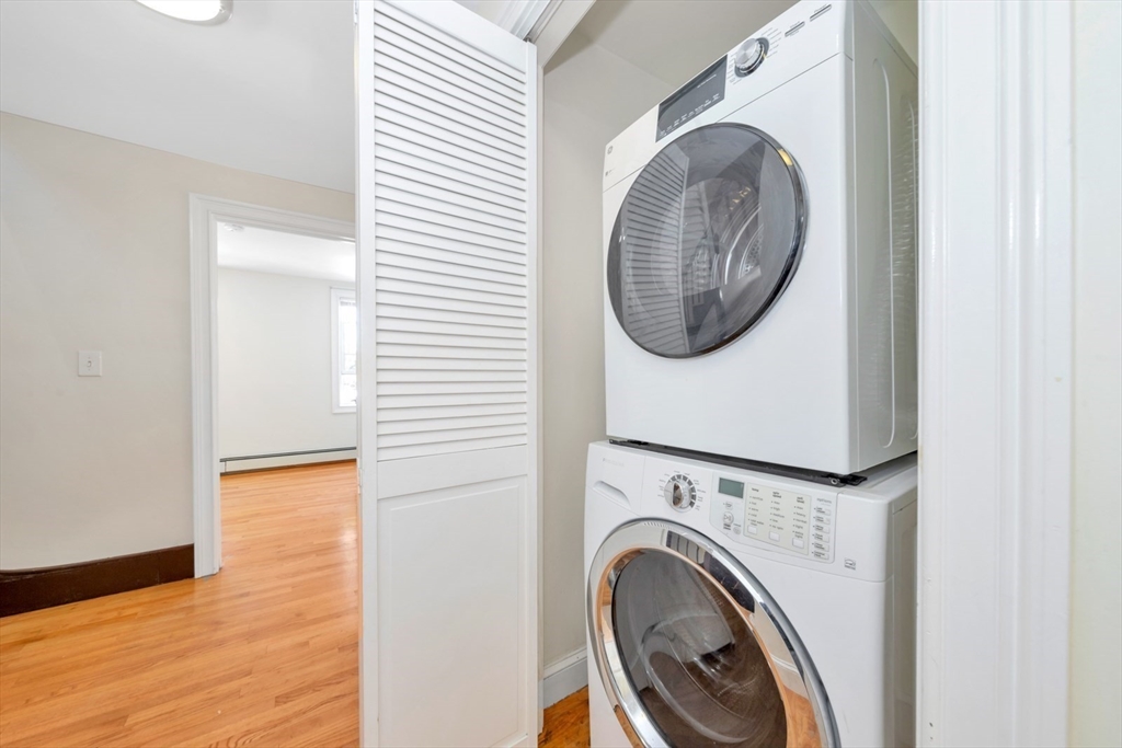 4 School Street, Unit 2 Boston, MA 02119 - Photo 17 of 25 a view of a hallway with washer and dryer