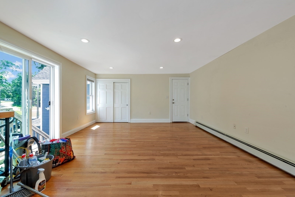 4 School Street, Unit 2 Boston, MA 02119 - Photo 20 of 25 a view of an empty room with wooden floor and windows