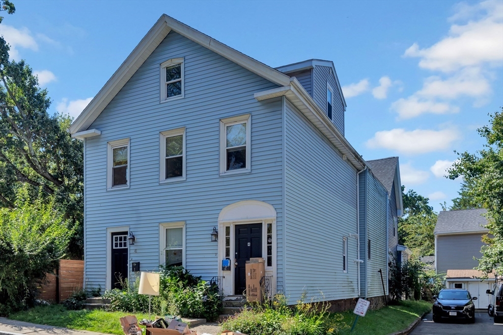 4 School Street, Unit 2 Boston, MA 02119 - Photo 2 of 25 a front view of a house with garden