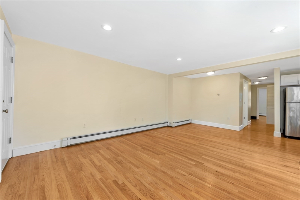 4 School Street, Unit 2 Boston, MA 02119 - Photo 22 of 25 a view of an empty room with wooden floor