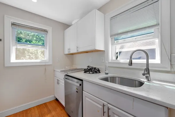 a kitchen with a sink and a window