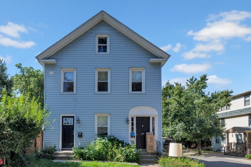 4 School Street, Unit 2 Boston, MA 02119 - Photo 3 of 25 a front view of a house with a garden