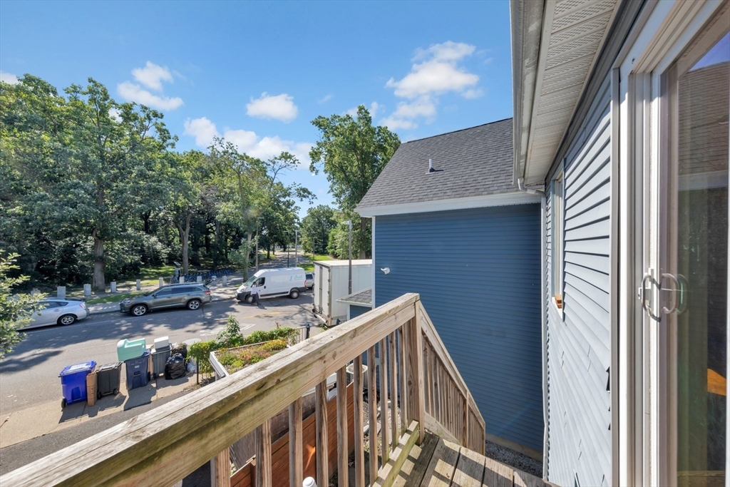 4 School Street, Unit 2 Boston, MA 02119 - Photo 4 of 25 a balcony with lots of green space