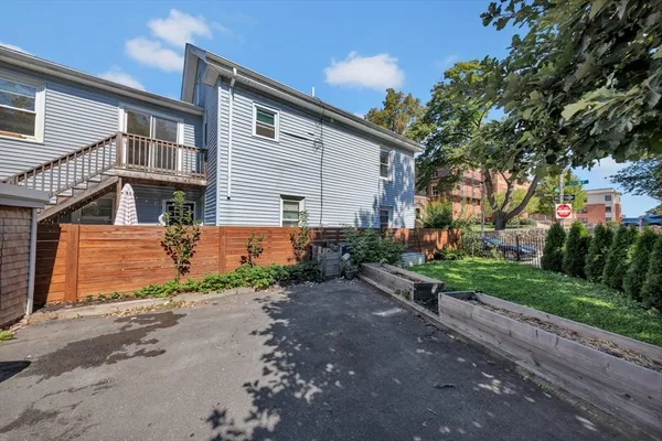 a front view of a house with a yard and a garage
