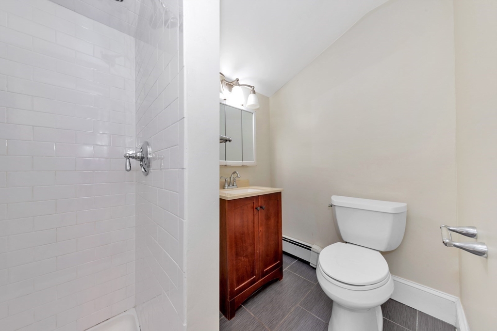 4 School Street, Unit 2 Boston, MA 02119 - Photo 6 of 25 a bathroom with a toilet