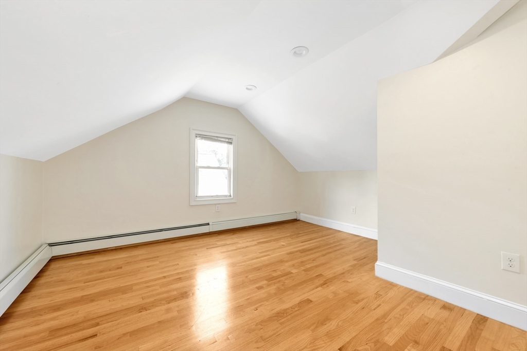 4 School Street, Unit 2 Boston, MA 02119 - Photo 7 of 25 a view of an empty room with wooden floor and a window