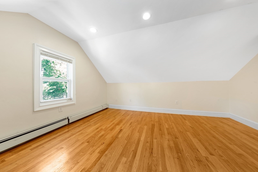 4 School Street, Unit 2 Boston, MA 02119 - Photo 10 of 25 an empty room with wooden floor and windows