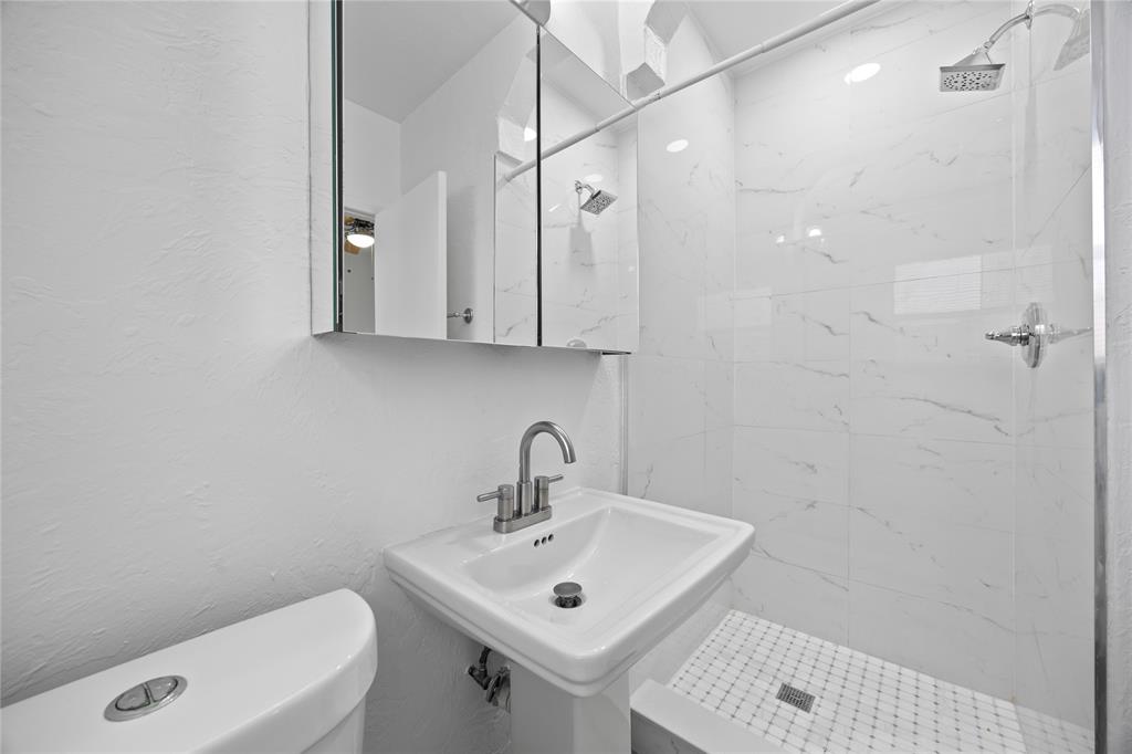 412 Southeast 16th Street, Unit 2 Fort Lauderdale, FL 33316 - Photo 14 of 20 a bathroom with a sink a toilet and shower