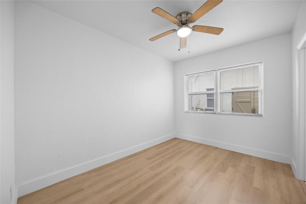 412 Southeast 16th Street, Unit 2 Fort Lauderdale, FL 33316 - Photo 10 of 20 a view of a big room with wooden floor and a ceiling fan