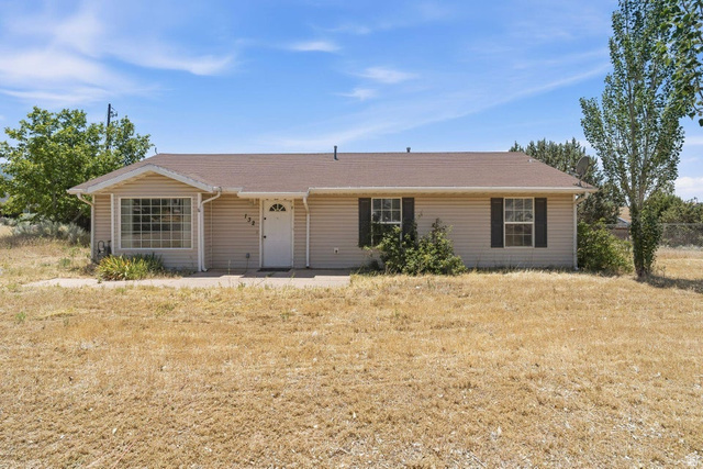 132 Rex Layne Drive Central, UT 84722 - Photo 2 of 39 Ranch-style exterior with horizontal siding, a gabled roof, and a bay window