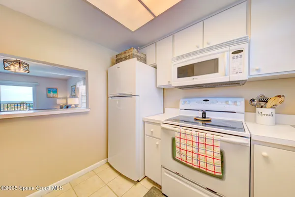 a kitchen with stainless steel appliances a refrigerator sink and cabinets