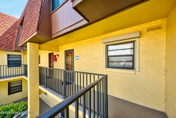 a view of balcony with furniture