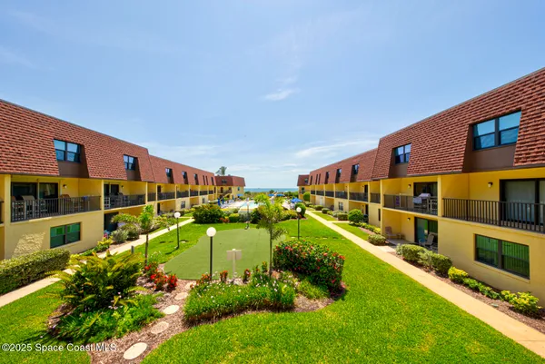 a view of an houses with swimming pool