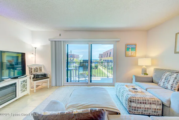 a bedroom with furniture and a flat screen tv