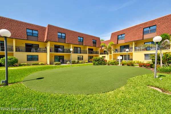 a front view of building with outdoor space