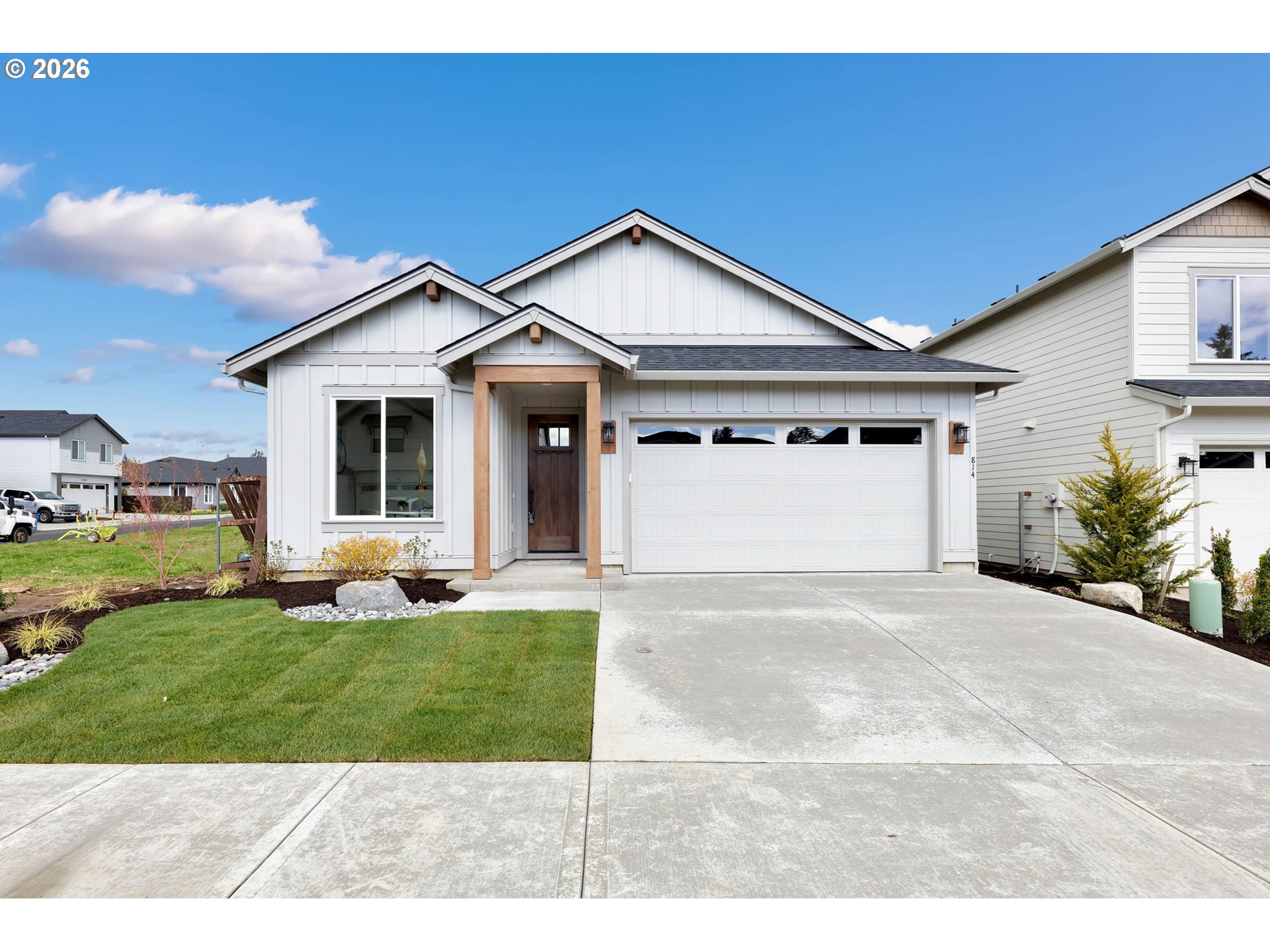 814 Southeast 35th Street Battle Ground, WA 98604 - Photo 1 of 37 a view of a yard in front of a house with a garden