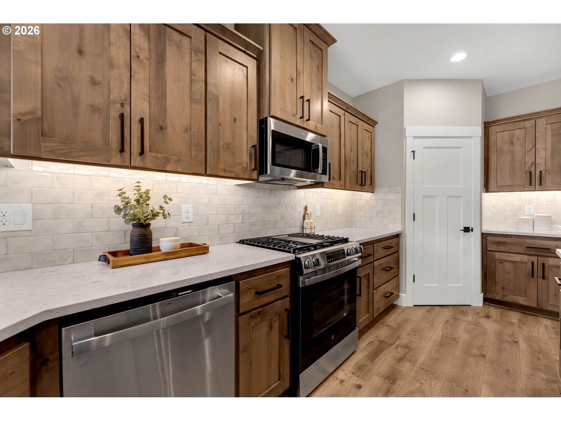 814 Southeast 35th Street Battle Ground, WA 98604 - Photo 21 of 37 a kitchen with stainless steel appliances a sink stove and microwave