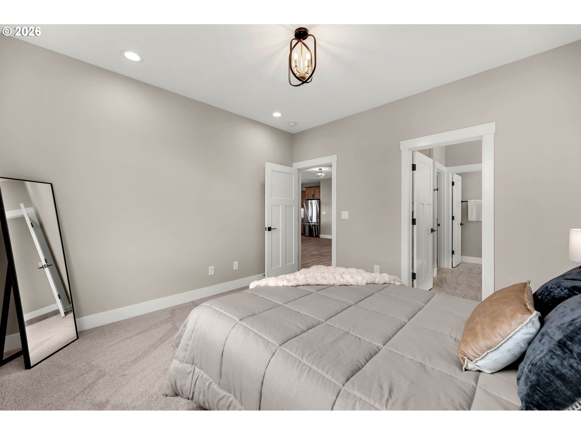 814 Southeast 35th Street Battle Ground, WA 98604 - Photo 30 of 37 a bedroom with a bed and a walk in closet