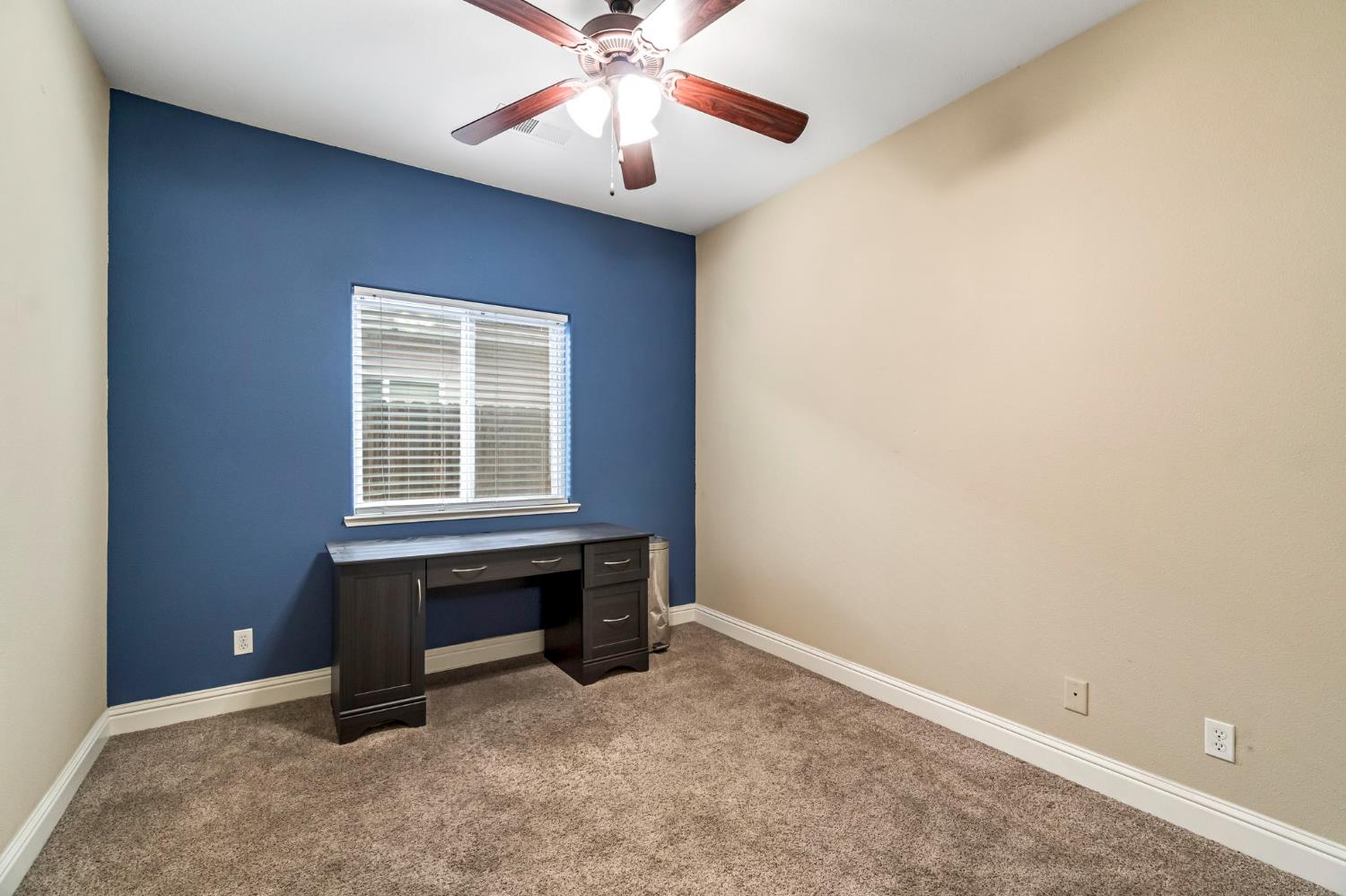 2634 Marie Drive Madera, CA 93637 - Photo 21 of 32 an empty room with a window and a ceiling fan