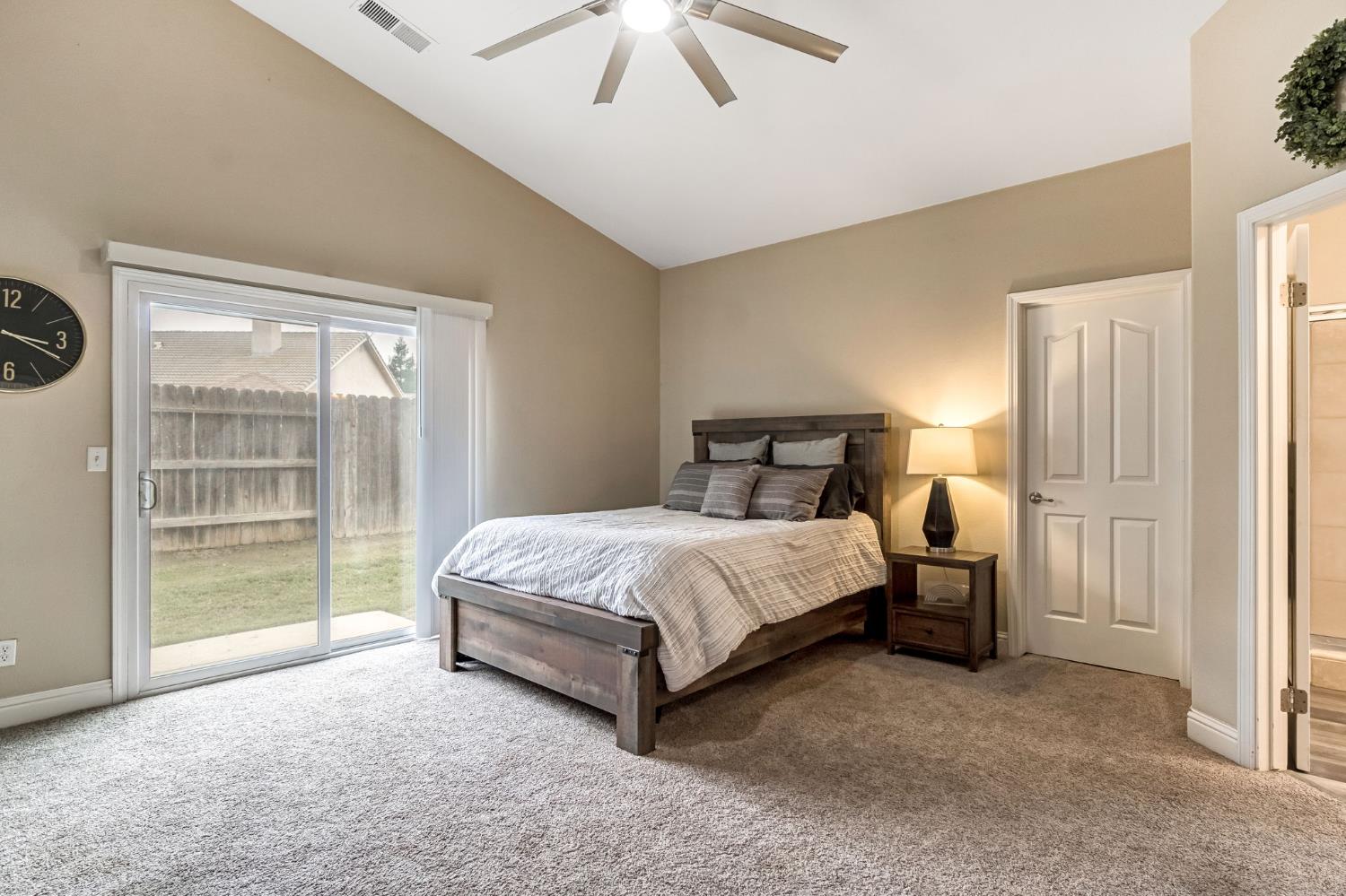 2634 Marie Drive Madera, CA 93637 - Photo 26 of 32 a bedroom with a bed and a window