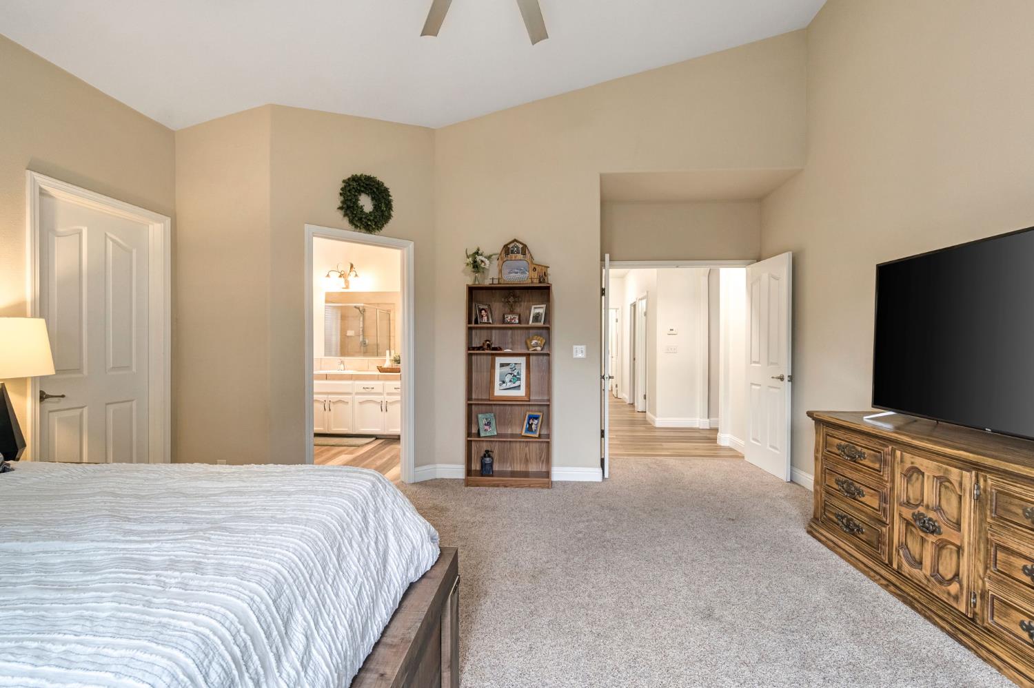 2634 Marie Drive Madera, CA 93637 - Photo 27 of 32 a bedroom with a bed and a flat screen tv