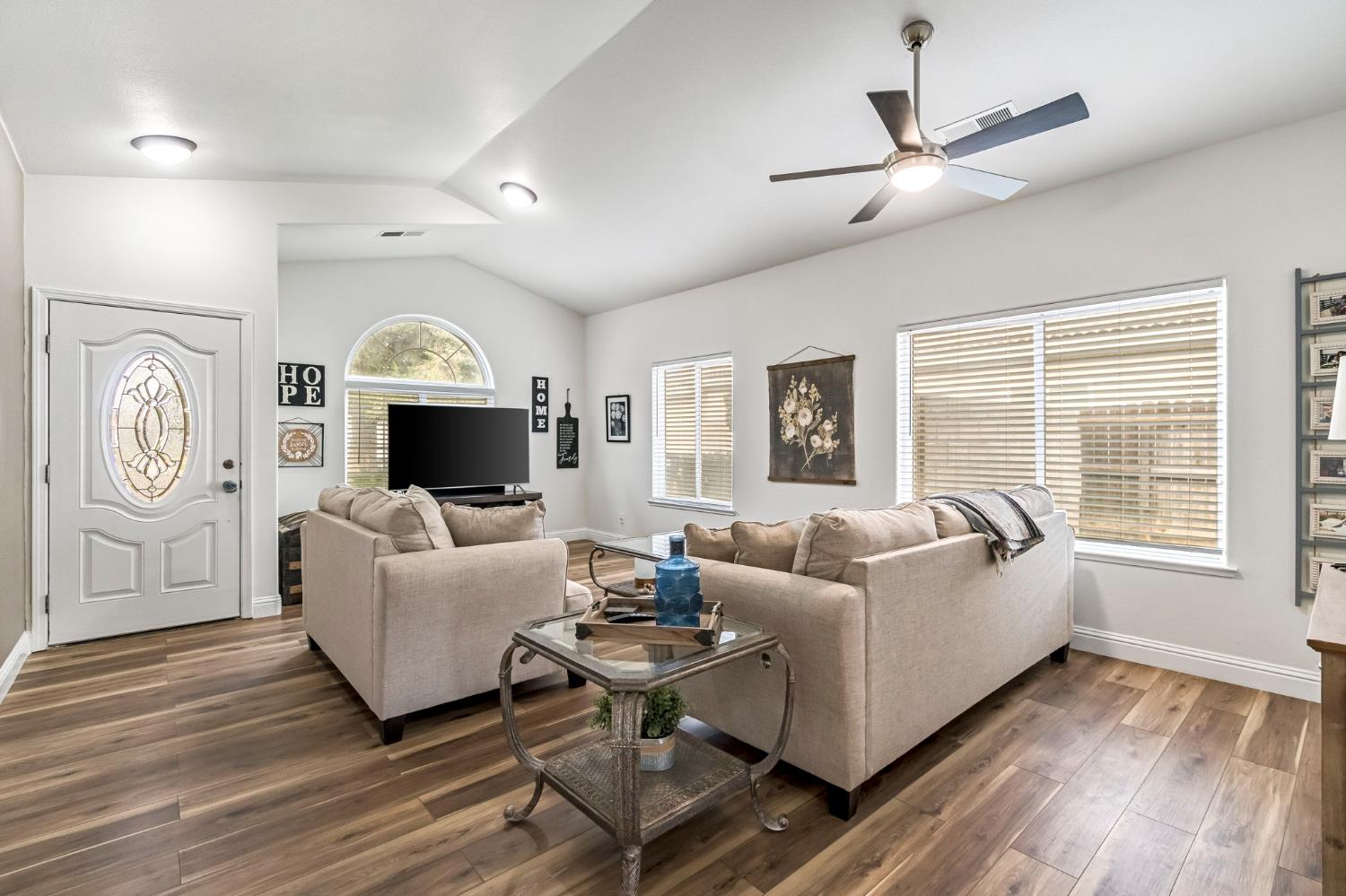 2634 Marie Drive Madera, CA 93637 - Photo 5 of 32 a living room with furniture a large window and a fireplace