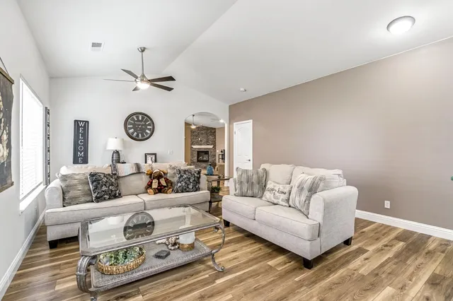 a living room with furniture and a window