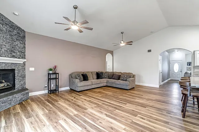 a living room with furniture and a fireplace