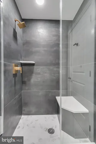 a bathroom with a shower and toilet