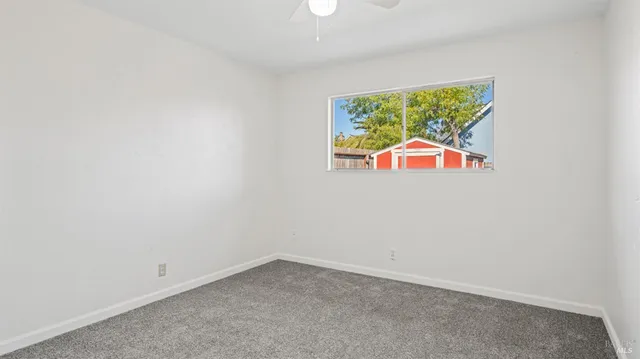 a view of backyard with cabin