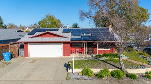 an aerial view of a house with a swimming pool