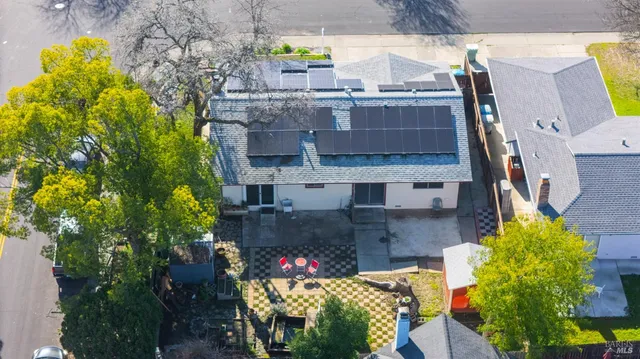an aerial view of a house with a swimming pool