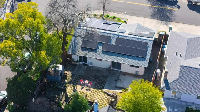 an aerial view of a house with a swimming pool