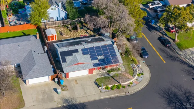 an aerial view of residential houses with outdoor space