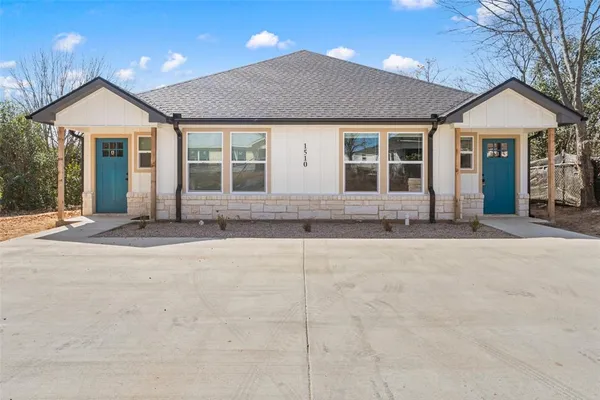 front view of a house with a yard