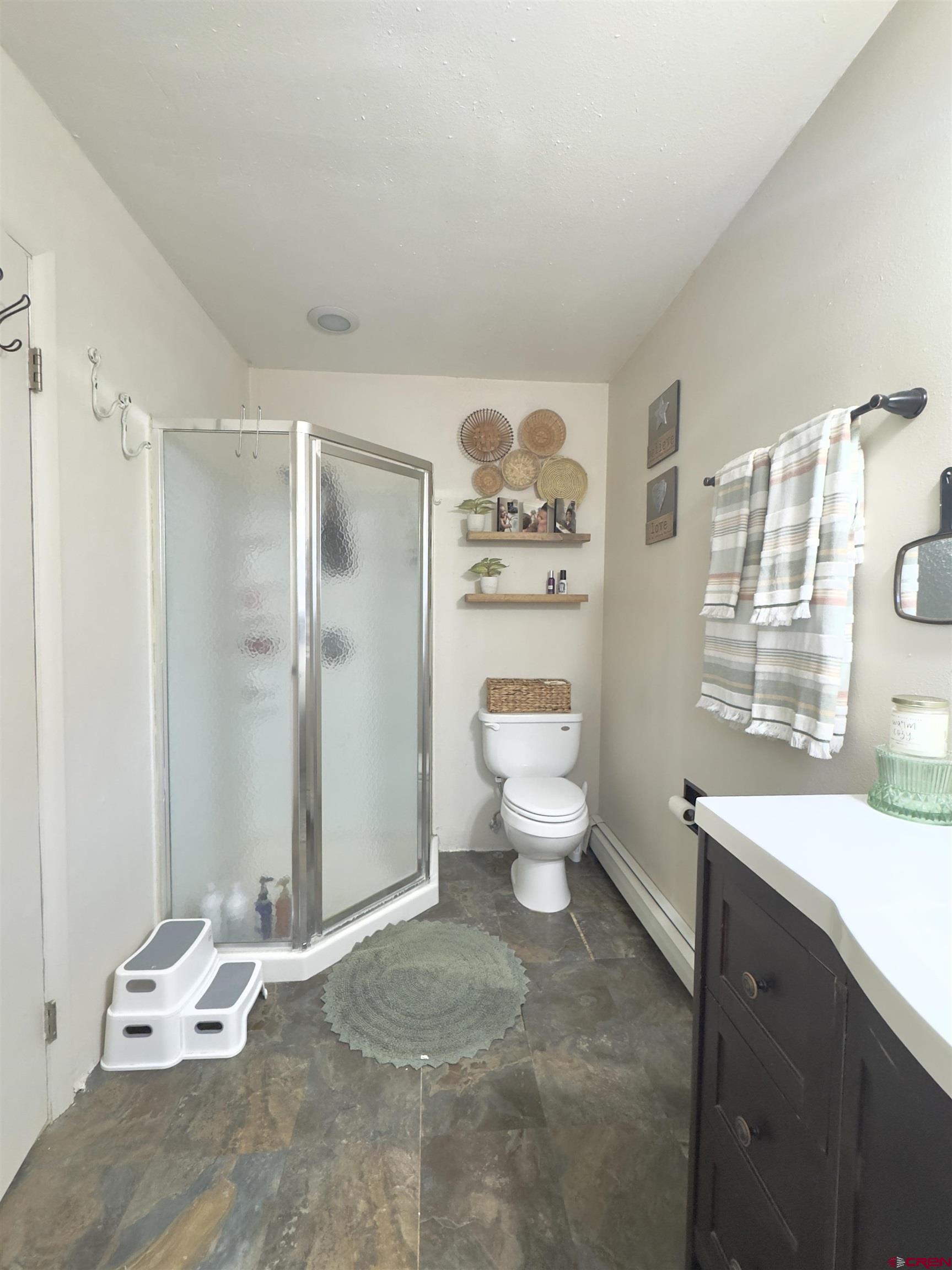 660 Columbia Avenue Del Norte, CO 81132 - Photo 20 of 31 a spacious bathroom with a toilet sink and shower