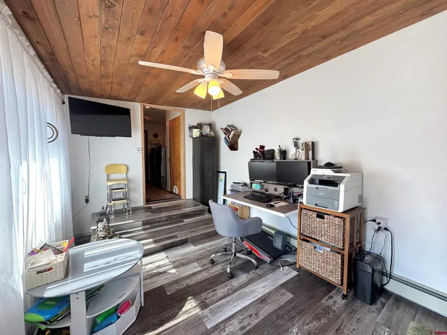 a room with furniture and wooden floor