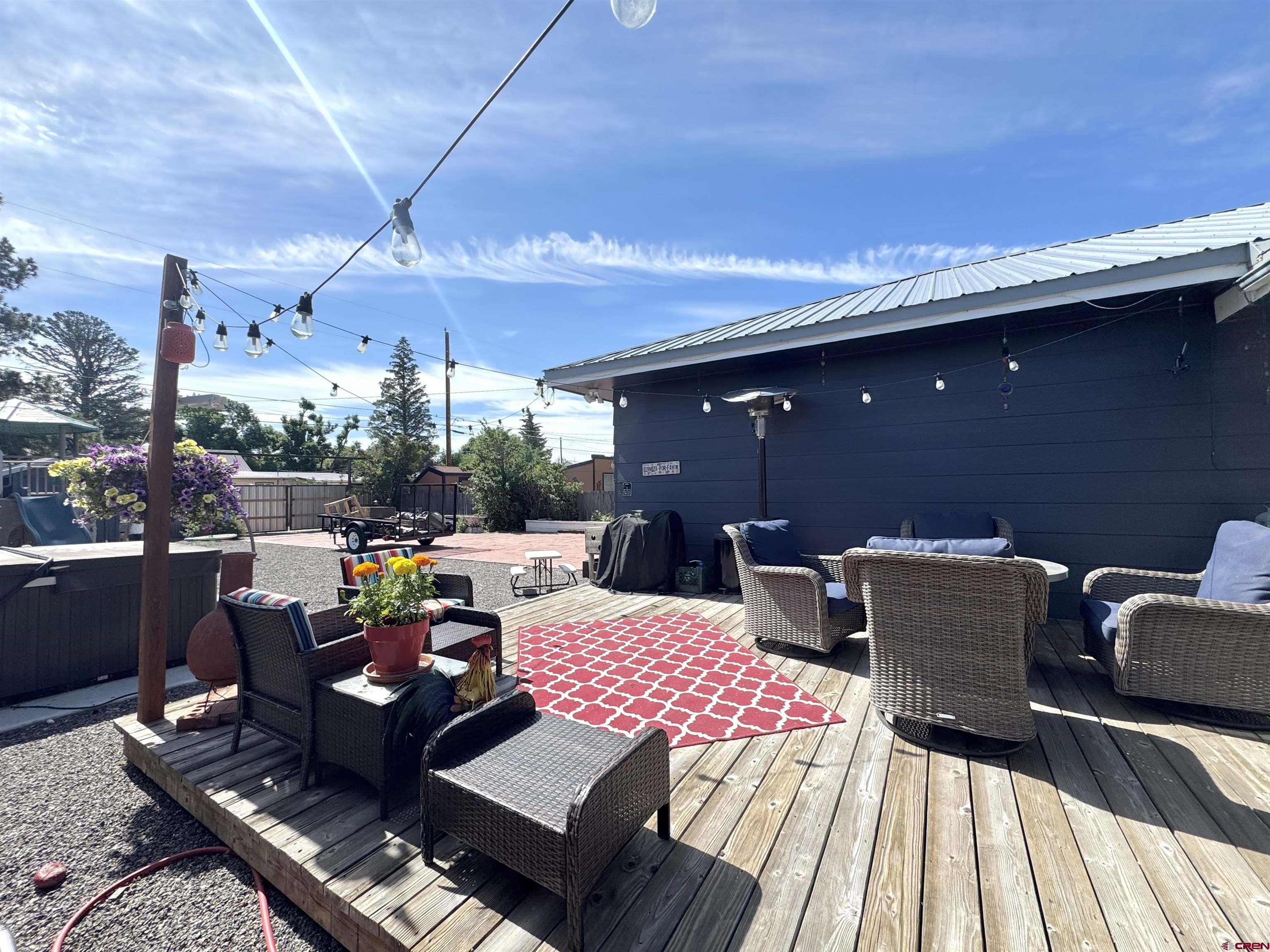660 Columbia Avenue Del Norte, CO 81132 - Photo 27 of 31 a view of a patio with table and chairs and potted plants