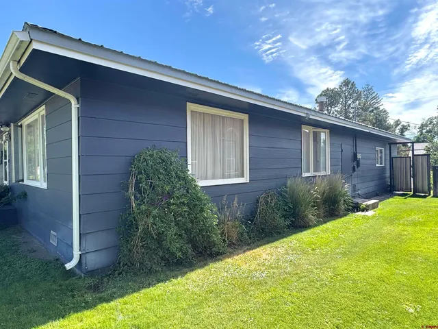 a view of a backyard of the house