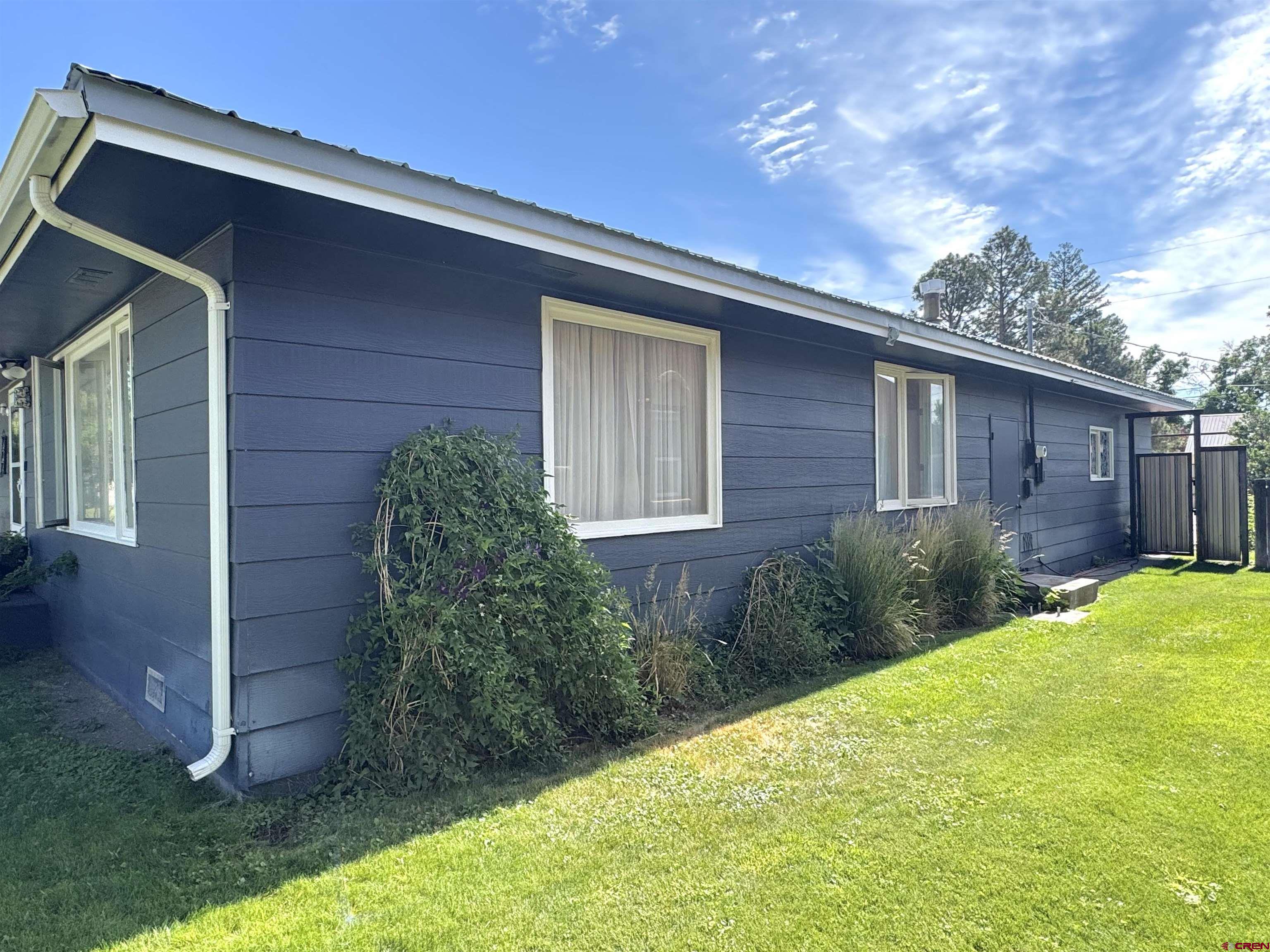 660 Columbia Avenue Del Norte, CO 81132 - Photo 3 of 31 a view of a backyard of the house