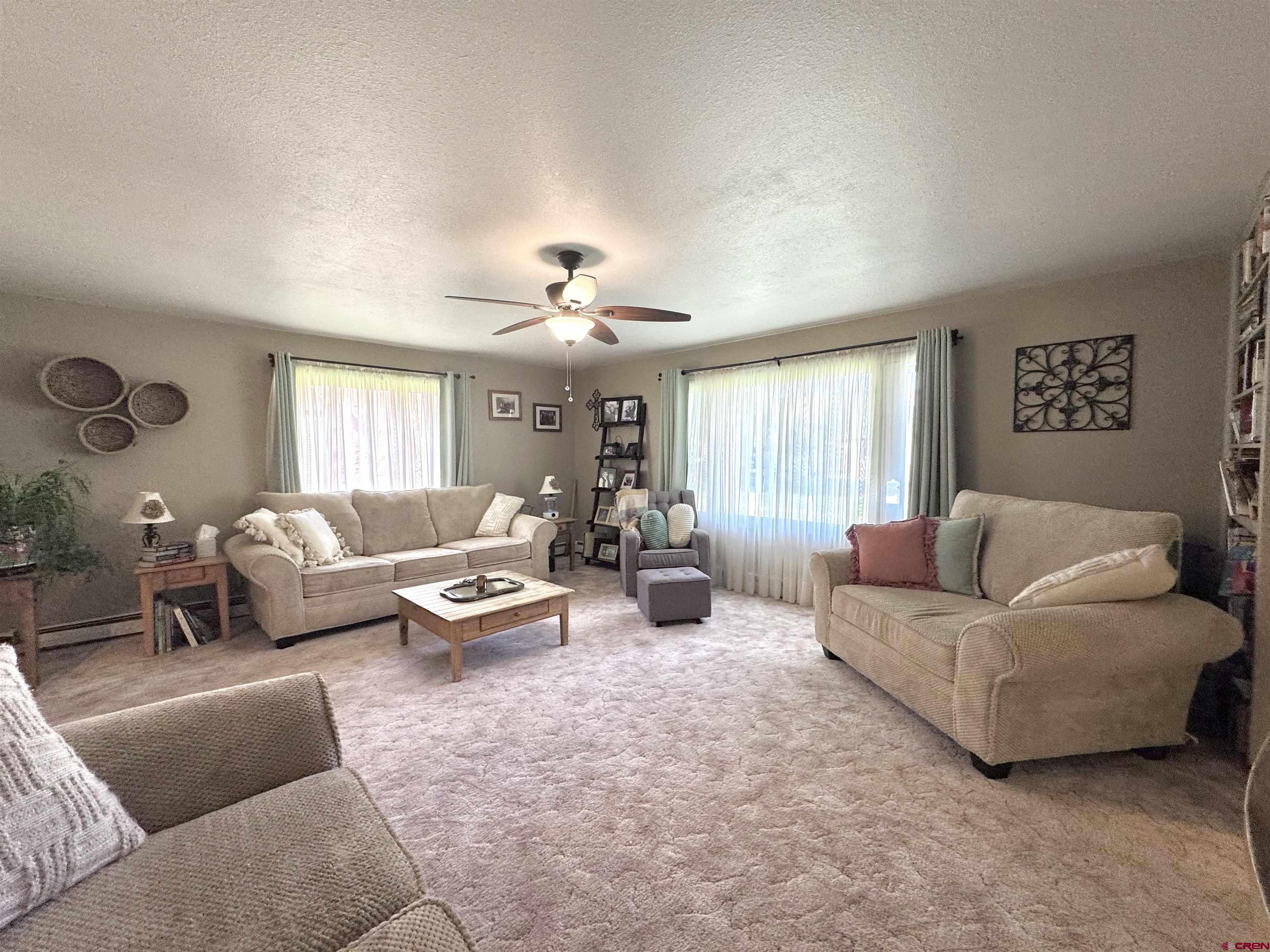 660 Columbia Avenue Del Norte, CO 81132 - Photo 5 of 31 a living room with furniture and a large window