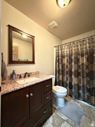 2095 West 4100 North Spring Glen, UT 84526 - Photo 8 of 35 Bathroom with vanity and curtained shower