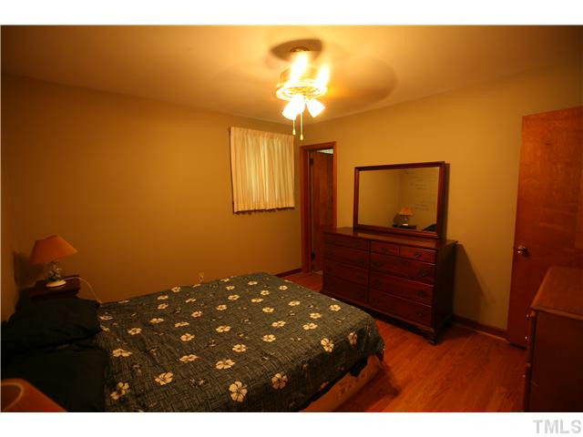 2709 Duke Homestead Road Durham, NC 27705 - Photo 11 of 15 Master bedroom features ceiling fan with light, large closet, hardwood flooring and private bath. Master Bedroom