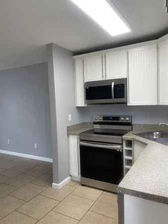 a kitchen with a stove and a microwave