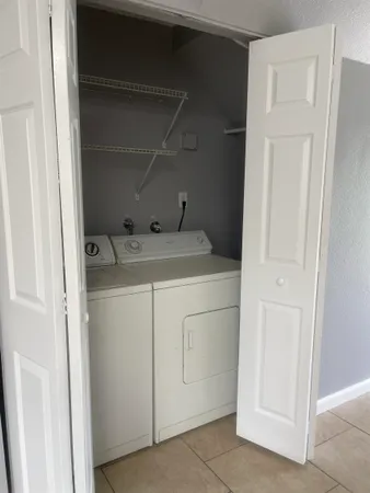 a utility room with dryer and washer