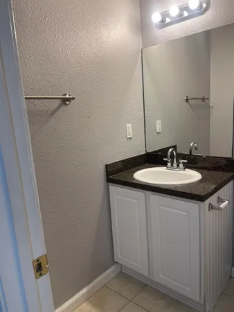 a sink with a mirror
