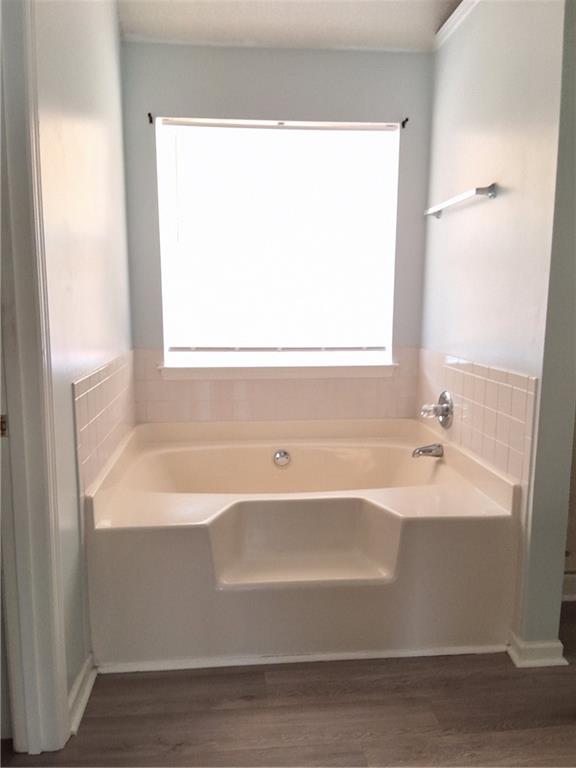 2909 Gala Trail Southwest Snellville, GA 30039 - Photo 16 of 22 a white bath tub sitting next to a window