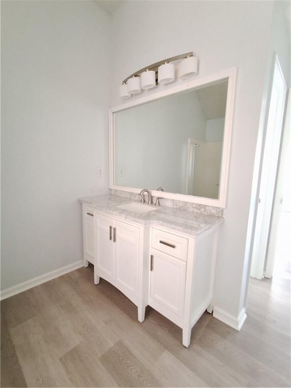 2909 Gala Trail Southwest Snellville, GA 30039 - Photo 17 of 22 a bathroom with a sink and mirror