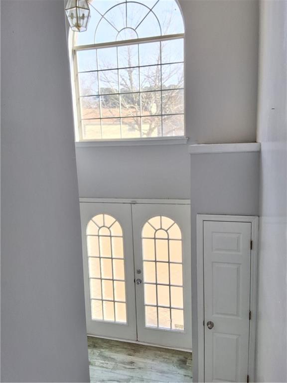 2909 Gala Trail Southwest Snellville, GA 30039 - Photo 4 of 22 an empty room with windows and chandelier