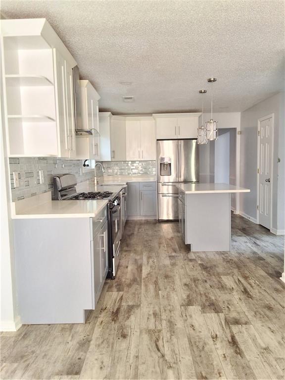 2909 Gala Trail Southwest Snellville, GA 30039 - Photo 7 of 22 a kitchen with a sink stove and refrigerator